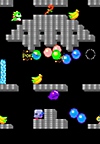 Bubble Bobble – Gameplay-Screenshot mit dem Hauptcharakter Bubblun, der eine aus Blöcken bestehende, burgähnliche Landschaft durchquert