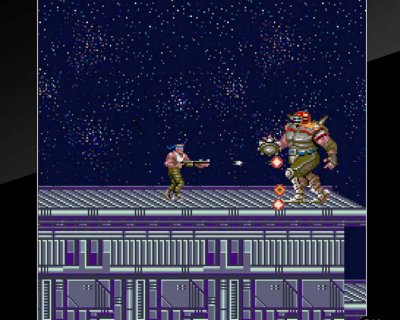 《Contra》游戏截屏，展示了一名士兵在建筑物屋顶与一个巨大人形外星人作战。