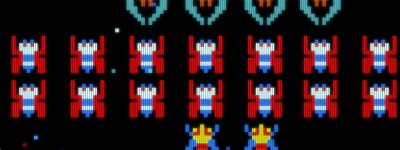  Galaga gameplay screenshot featuring multiple pixelated sprites against a black background.