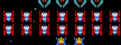  لقطة شاشة من تجربة اللعب في Galaga تعرض عدة عفاريت منتشرة على خلفية سوداء.