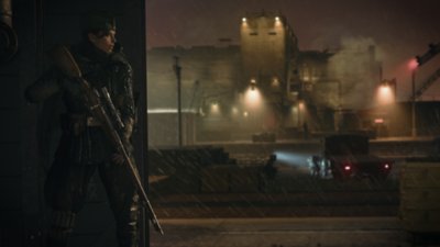 Captura de pantalla de Call of Duty Vanguard mostrando a un personaje poniéndose a cubierto tras un muro con enemigos a lo lejos