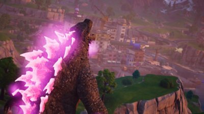 Snimak ekrana igre Fortnite na kom je prikazano kako se Godzilla približava gradu