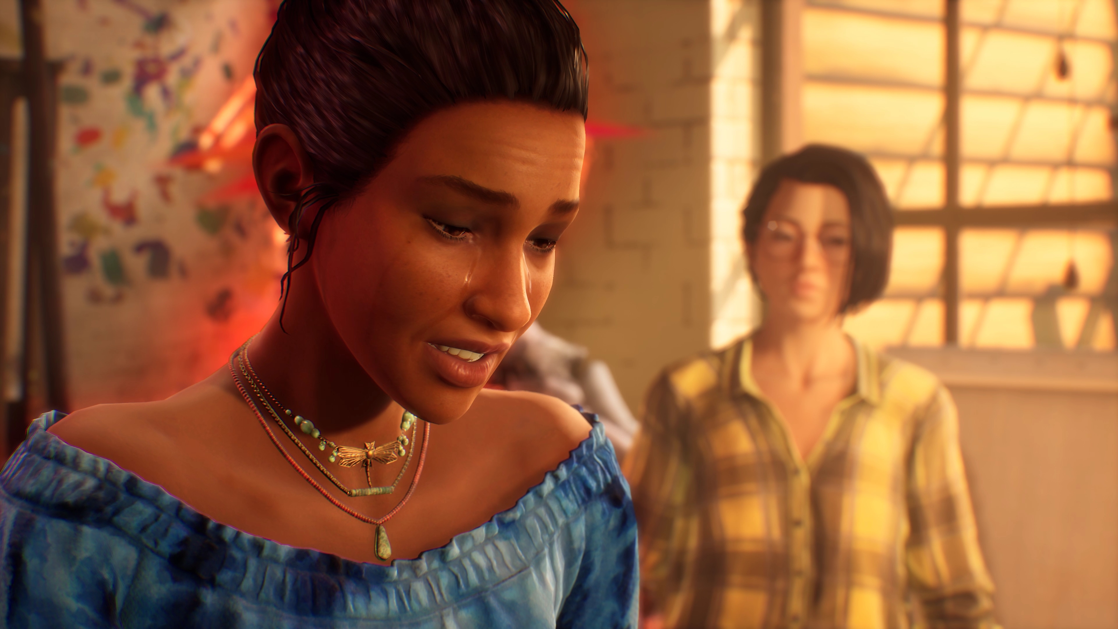 《Life is Strange True Colors》的屏幕截图，显示 Alex 与一名正在哭泣的人物交谈
