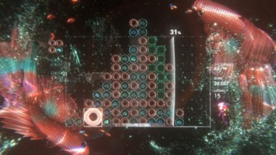 Lumines Arise screenshot showing the game grid with fish around it
