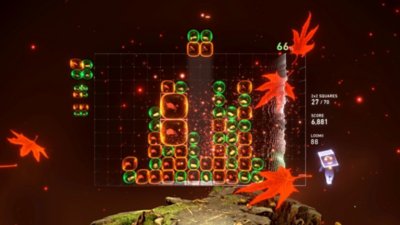 Lumines Arise screenshot showing gameplay with red leaves floating across the screen