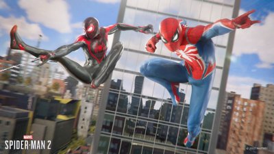 Miles Morales and Peter Parker in spider suits swing across the city in Marvel's Spider-Man 2 game