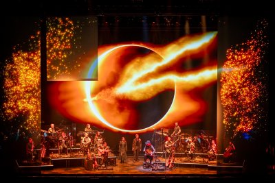 A blazing eclipse ignites the stage — myth and music collide in God of War.