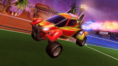 Rocket League screenshot showing a red buggy-type car with blue flames coming from the exhaust