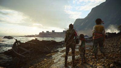 A Plague Tale: Requiem; captura de pantalla que muestra a Amicia y Hugo de pie en la costa, mirando un castillo a la distancia