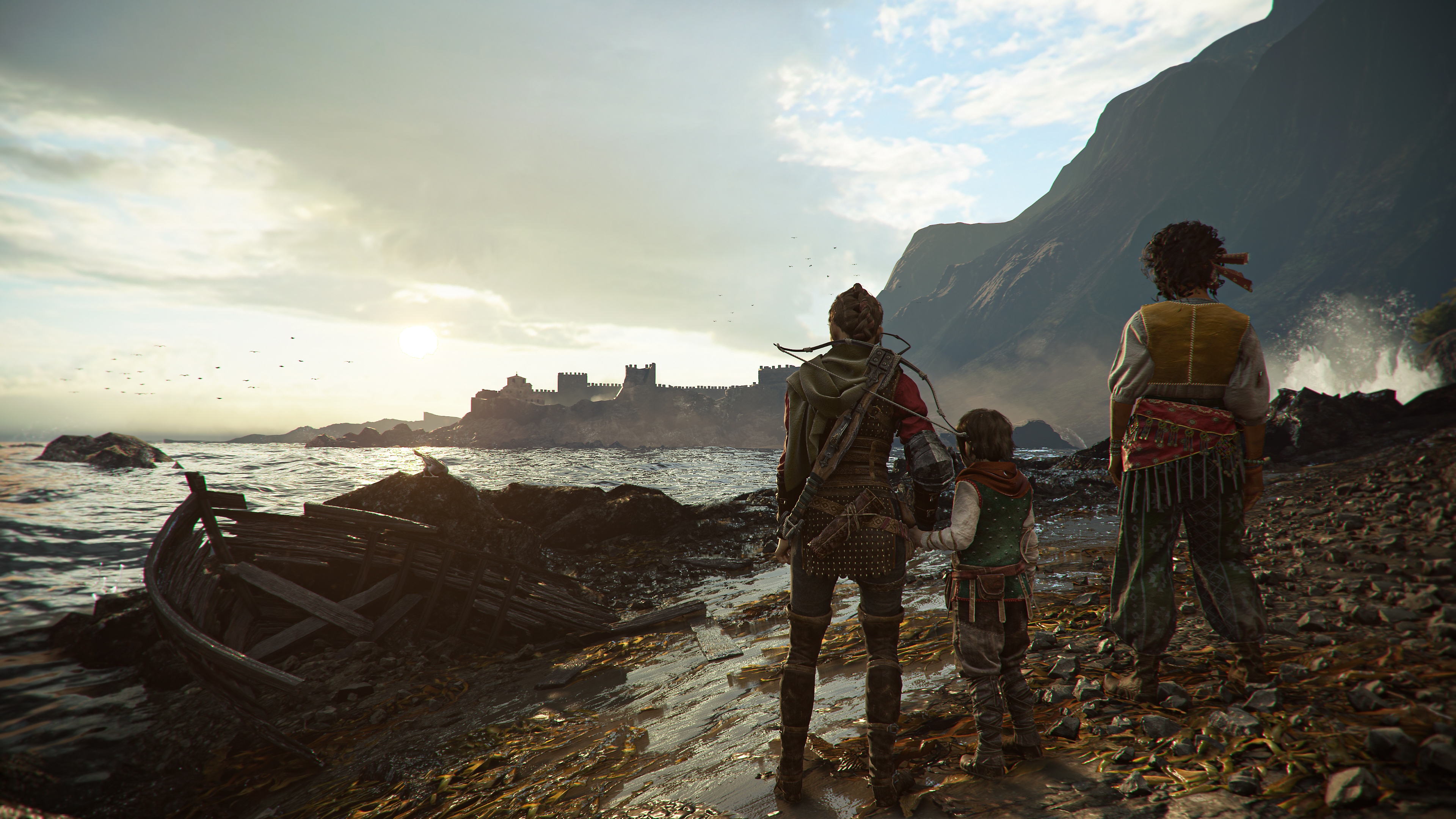 A Plague Tale: Requiem screenshot showing Amicia and Huge standing on the shoreline, overlooking a castle in the distance