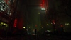 Alan Wake 2 - captură de ecran prezentându-l pe Alan Wake 2 în picioare în mijlocul unei străzi ce aduce cu New York în Dark Place