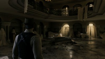 Screenshot von Alone in the Dark, der Edward Carnby in der Eingangshalle eines großen gotischen Gebäudes zeigt