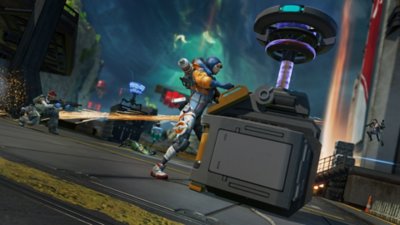 APEX Legends screenshot showing a character operating a machine while other charachters battle in the background.
