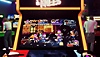 Arcade Paradise-screenshot van een spelkast met een retro arcadegame