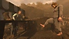 Baby Steps – Capture d'écran montrant notre protagoniste affublé d'une grenouillère essayant de marcher en direction d'un badaud blasé