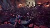 『バルダーズ・ゲート3』の背景イメージ。キャラクターが触手ばかりの場所で脳のような敵と戦っている。