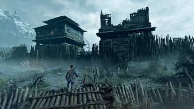 Capture d'écran de Banishers: Ghosts of New Eden – deux personnages explorent un fort délabré