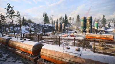 Battlefield 2042 – Screenshot mit großen Tankwagons, die sich in der Umgebung eines Bahnhofs befinden