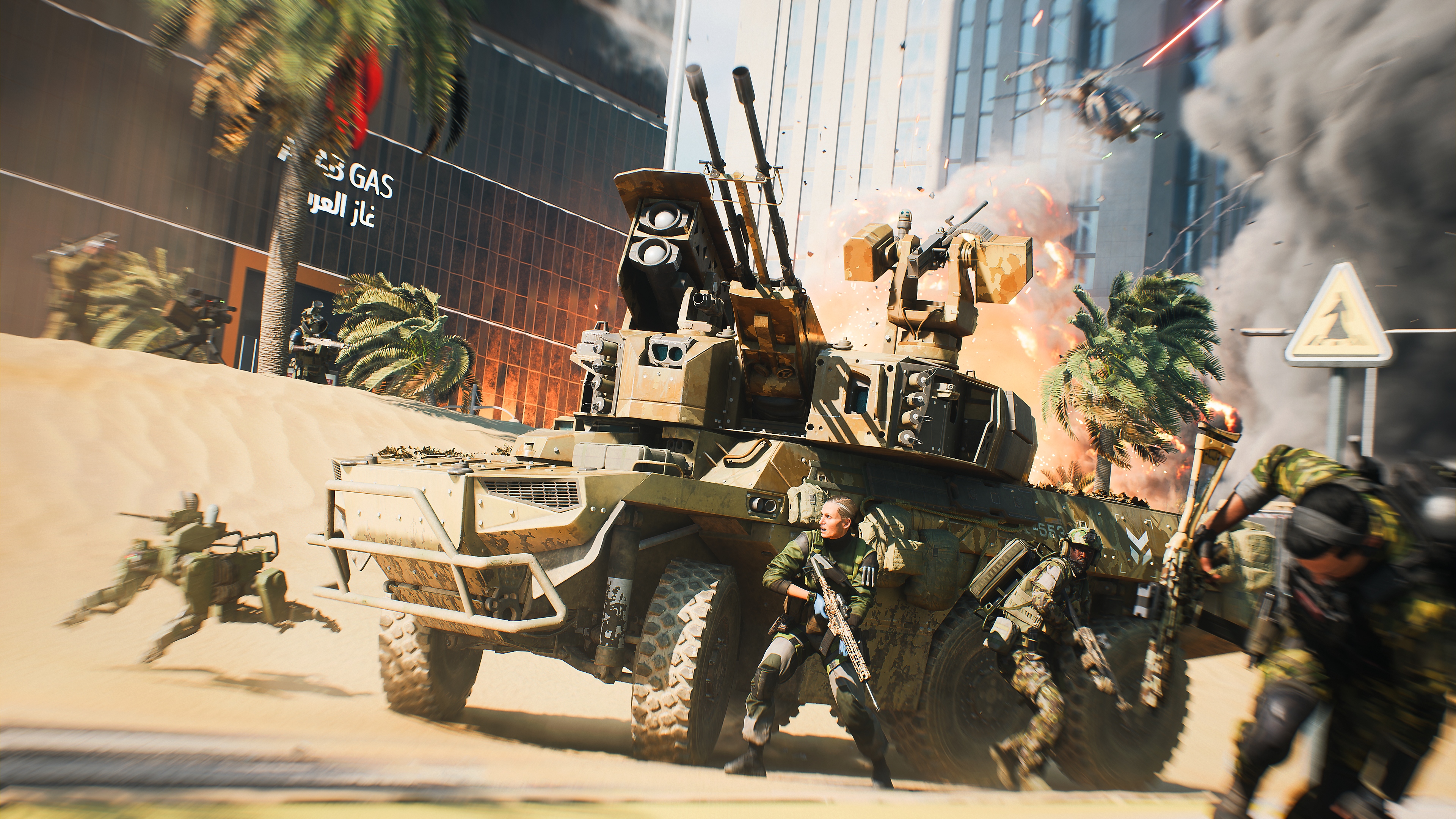 Skjermbilde fra Battlefield 2042 av spesialister som søker dekning bak et pansret kjøretøy