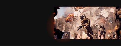 Soldiers battle as a building explodes into pieces behind them.