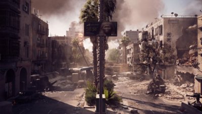 A devastated street in Cairo, populated with building wreckage, destroyed vehicles, and barricades.