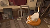 Behind the Frame: The Finest Scenery captura de pantalla que muestra a un gato bostezando y estirándose