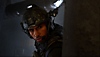 Call of Duty: Modern Warfare III screenshot showing Kyle 'Gaz' Garrick in tactical gear peering around a corner