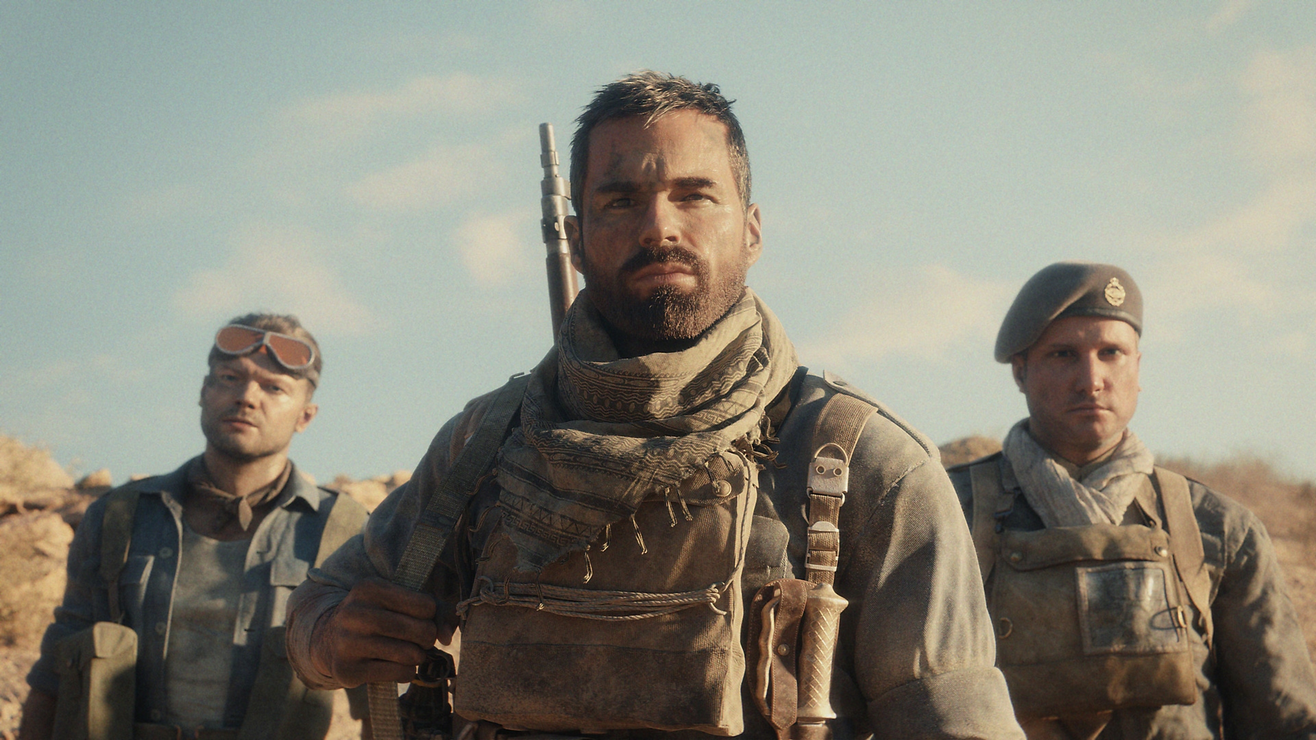 Snimka zaslona iz igre Call of Duty Vanguard koja prikazuje tri lika u opremi za pustinjske borbe
