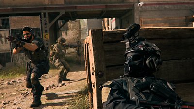 Call of Duty Warzone 2.0 screenshot showing a character in tactical gear hiding from two others