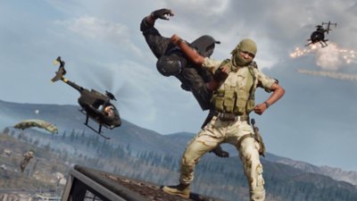 Call of Duty Warzone screenshot showing one Operator clotheslining another atop a building.