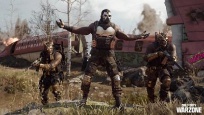 Üç Operatörün düşürülmüş bir uçağın gövdesi önünde poz verirken gösteren Call of Duty Warzone ekran görüntüsü