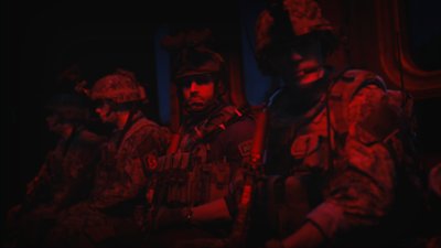 《決勝時刻：現代戰爭II》2022螢幕截圖，顯示三個角色站在一片紅光中