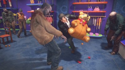 Dead Rising Deluxe Remaster screenshot showing Frank attacking a zombie using a large stuffed toy