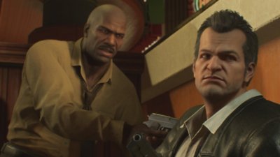 Dead Rising Deluxe Remaster screenshot showing a human character pointing a gun at Frank