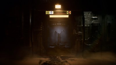 Dead Space screenshot showing a menacing creature standing at the end of a corridor