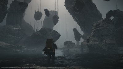 A Death Stranding 2: On the Beach képernyőképe, amelyen Sam különös, lebegő sziklákkal teli környezetben látható