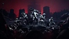 Captura de pantalla de Destiny 2 Hacia la Luz que muestra a cinco guardianes parados de forma heroica en frente de un cielo rojo oscuro