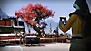 Capture d'écran de Destiny 2 montrant un Gardien qui utilise un appareil de type tablette 