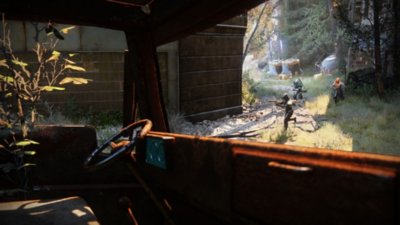 Destiny 2 screenshot showing a fireteam of three Guardians as seen from the inside of an old vehicle.
