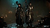 Diablo IV screenshot showing male and female sorcerers in a full Crow armor set 
