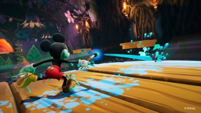 Captura de pantalla de Disney Epic Mickey: Rebrushed que muestra a Mickey Mouse lanzando pintura con su pincel