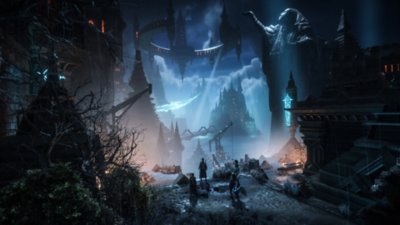 Dragon Age: The Veilguard – Capture d'écran montrant un groupe observant un paysage semé de statues, avec une grande forteresse en arrière-plan