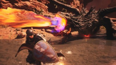 《Dragon's Dogma 2》- 截屏：一只琥珀焰龙向身披铠甲的人类角色喷火