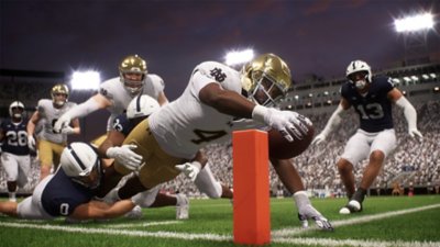 EA Sports College Football 26 - captura de ecrã que mostra um jogador a mergulhar para marcar