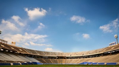 EA Sports College Football 25 background art featuring a wide shot of a stadium interior