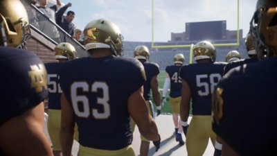 EA Sports College Football 25 screenshot showing Notre Dame Fighting Irish players approaching the field.