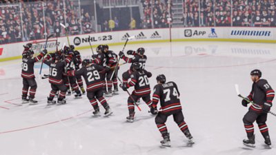 Екранни снимки на EA Sports NHL 23 на отбор, празнуващ вкаран гол.
