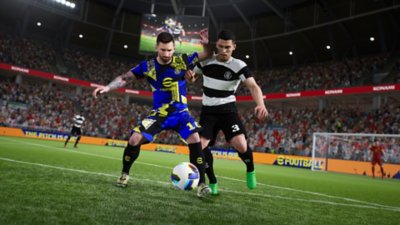 eFootball screenshot showing Messi shielding the ball from an opponent