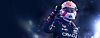 《F1 23》宣传海报：身穿红牛赛车服的马克斯·维斯塔潘举起一只拳头
