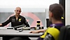 F1 23-screenshot van twee personages met elkaar in gesprek